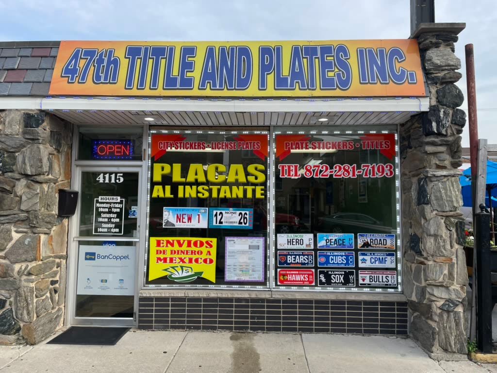 Storefront with a printed awning sign and window graphics