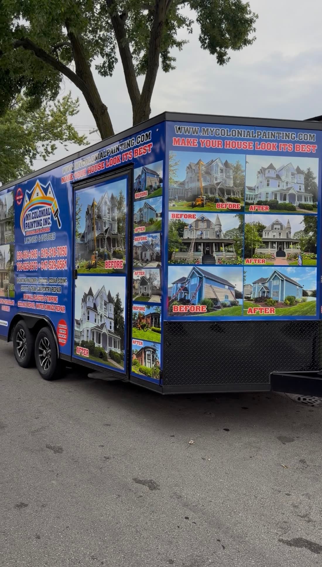 Blue enclosed trailer wrapped with a painting company's before and after photos